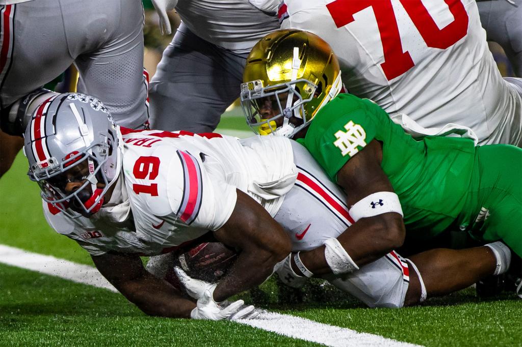 Chip Trayanum scores a touchdown in the final seconds to secure Ohio State's last-second win against Notre Dame.