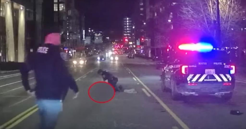 Body camera video captured the sudden death of a woman hit and killed by a Seattle police car as she was crossing the street.