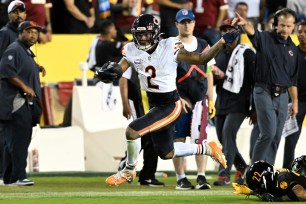 DJ Moore #2 of the Chicago Bears runs with the ball during the first half against the Washington Commanders at FedExField on October 05, 2023 