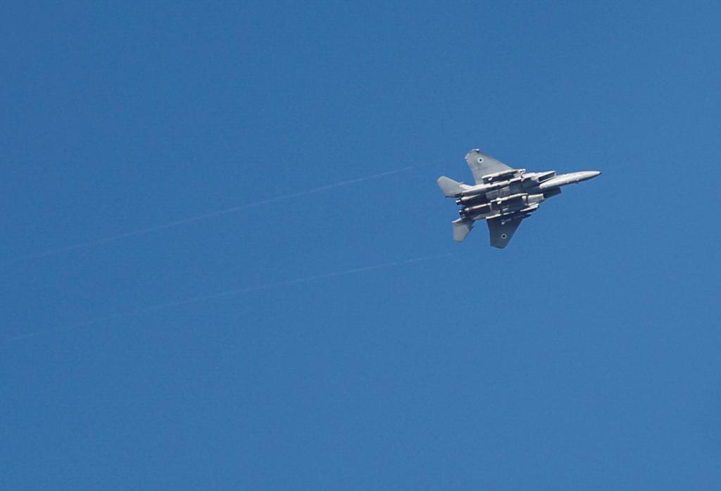 An Israeli war jet is seen as rocket barrages are launched from the Gaza Strip, in Ashdod, Israel October 7, 2023.