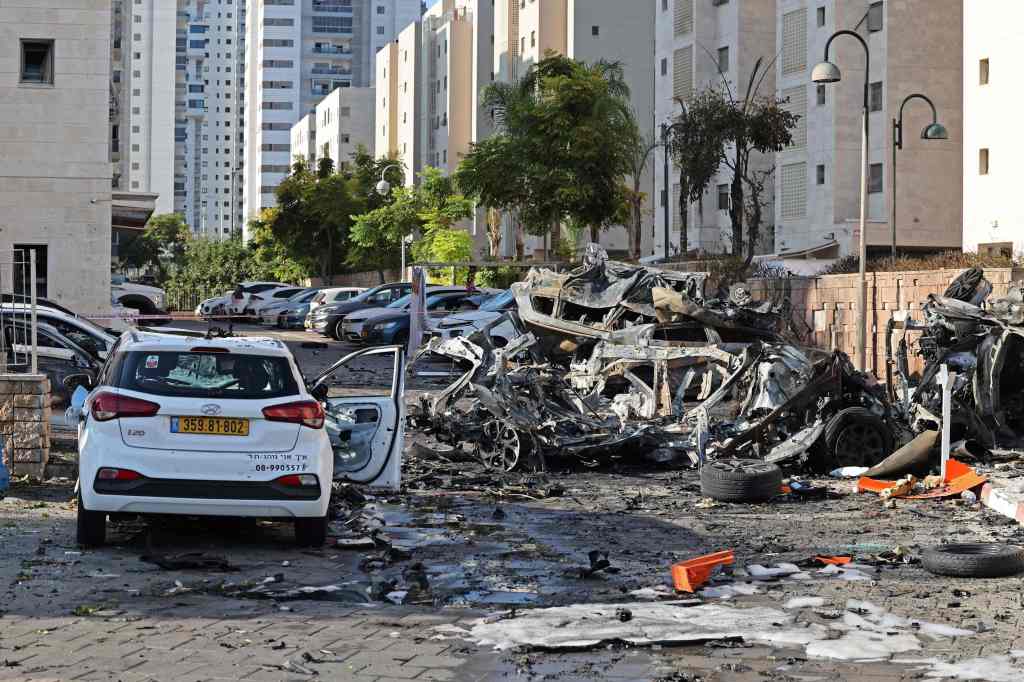 Burnt out vehicles in Ashkelon are pictured following a rocket attack from the Gaza Strip into Israel on October 7, 2023. 