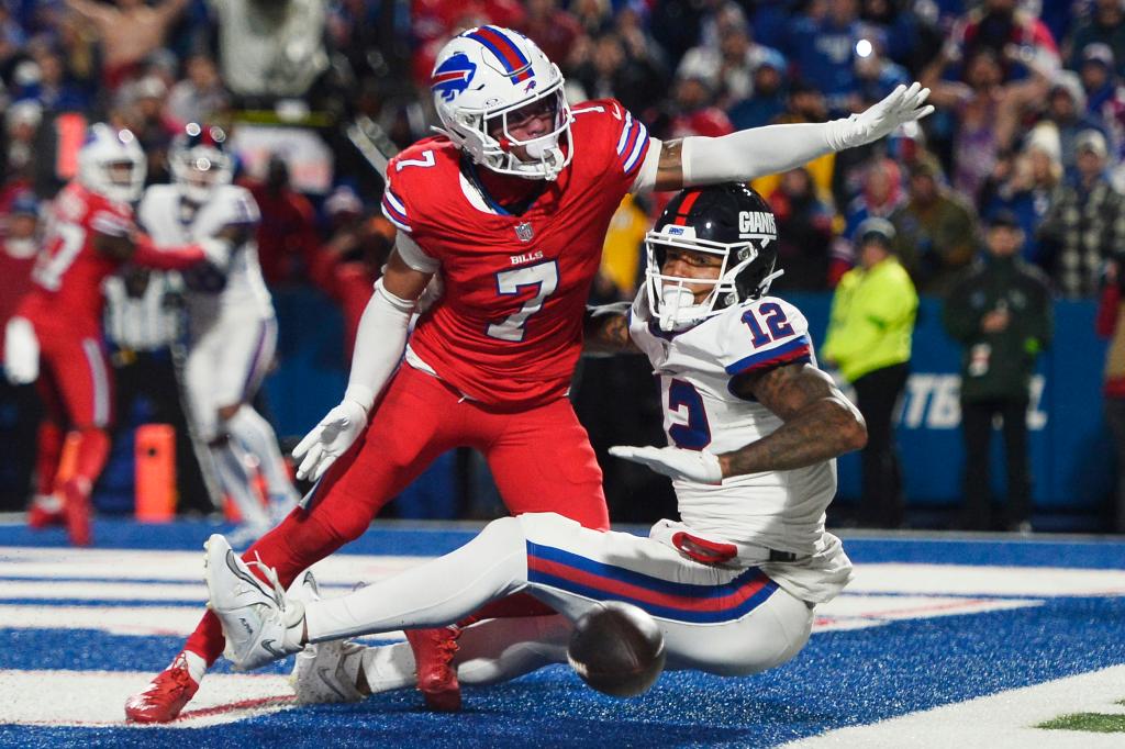 Buffalo Bills cornerback Taron Johnson (7) breaks up a pass to New York Giants tight end Darren Waller (12) on the final play of an NFL football game in Orchard Park, N.Y., Sunday, Oct. 15, 2023. The Bills defeated the Giants 14-9.