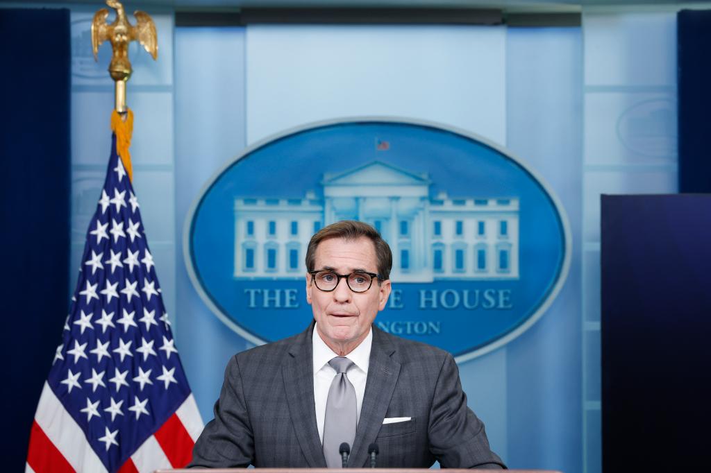 John Kirby in front of white house sign.