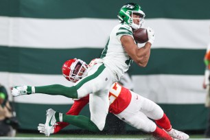 Allen Lazard makes the catch during the first half on Sunday as the Chiefs' Trent McDuffie defends.