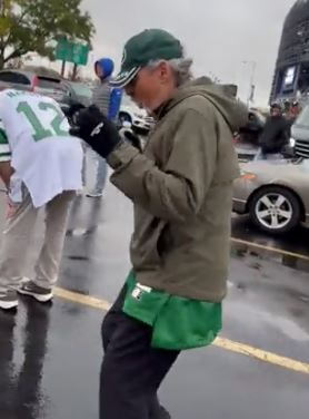 Joe Benigno celebrates the Jets' win over the Giants in the MetLife Stadium parking lot on Sunday.