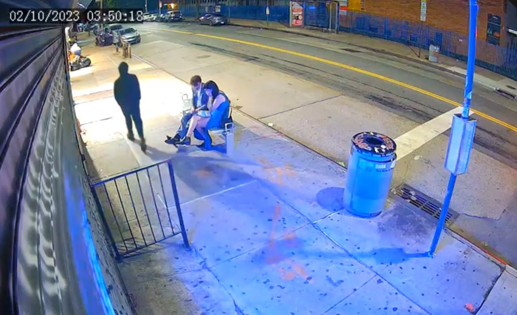 The couple was sitting at a bus stop bench chatting as the assailant walked by.
