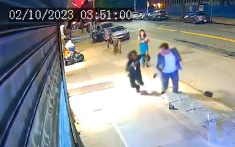 Surveillance video of a suspect running after Ryan Carson with a knife. 