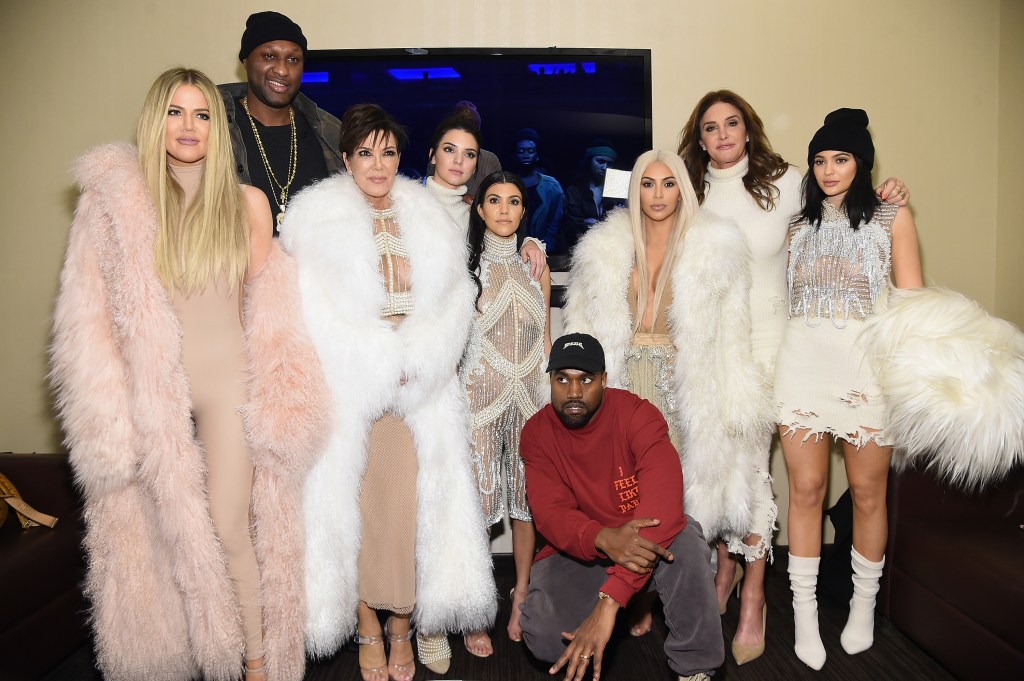 Khloe Kardashian, Lamar Odom, Kris Jenner, Kendall Jenner, Kourtney Kardashian, Kanye West, Kim Kardashian, Caitlin Jenner and Kylie Jenner in a group photo. 