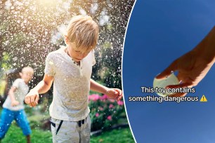 Photo of a child getting hit with water balloon.