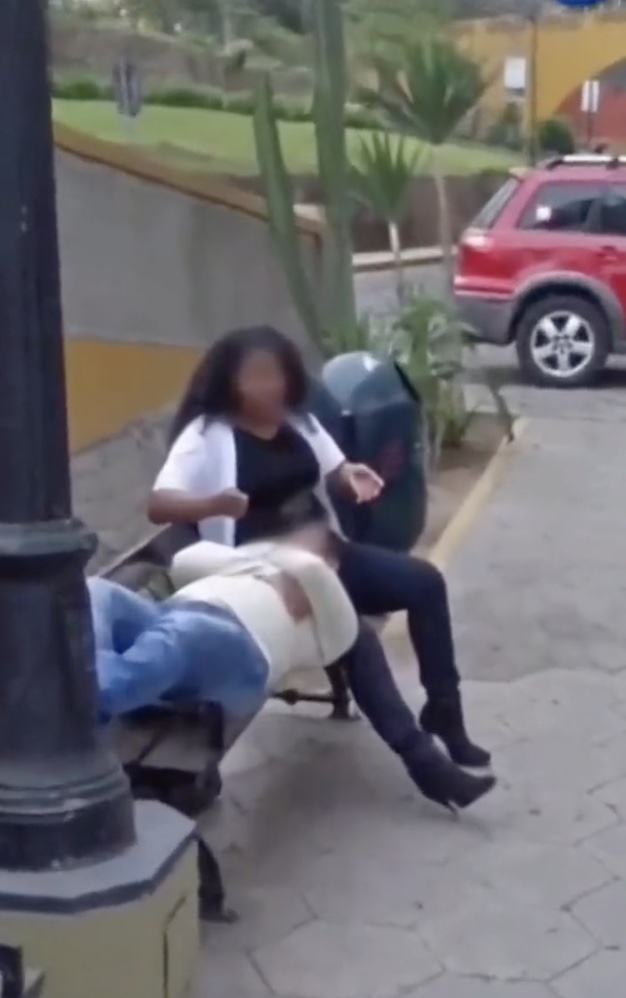 The video concludes with a snap of a man, who Lima says is her boyfriend, resting his head on a woman’s lap on a street bench.