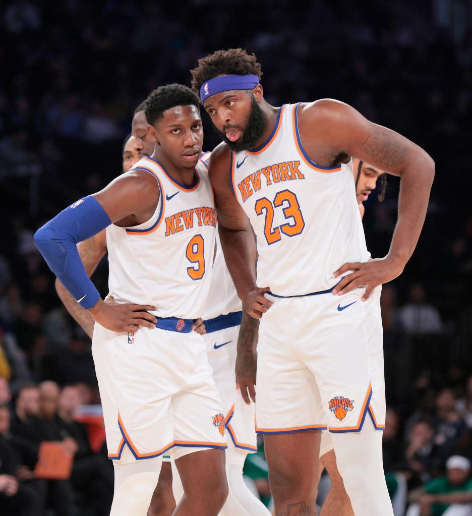 Knicks guard RJ Barrett #9 speaks with New York Knicks center Mitchell Robinson #23 during the first quarter.