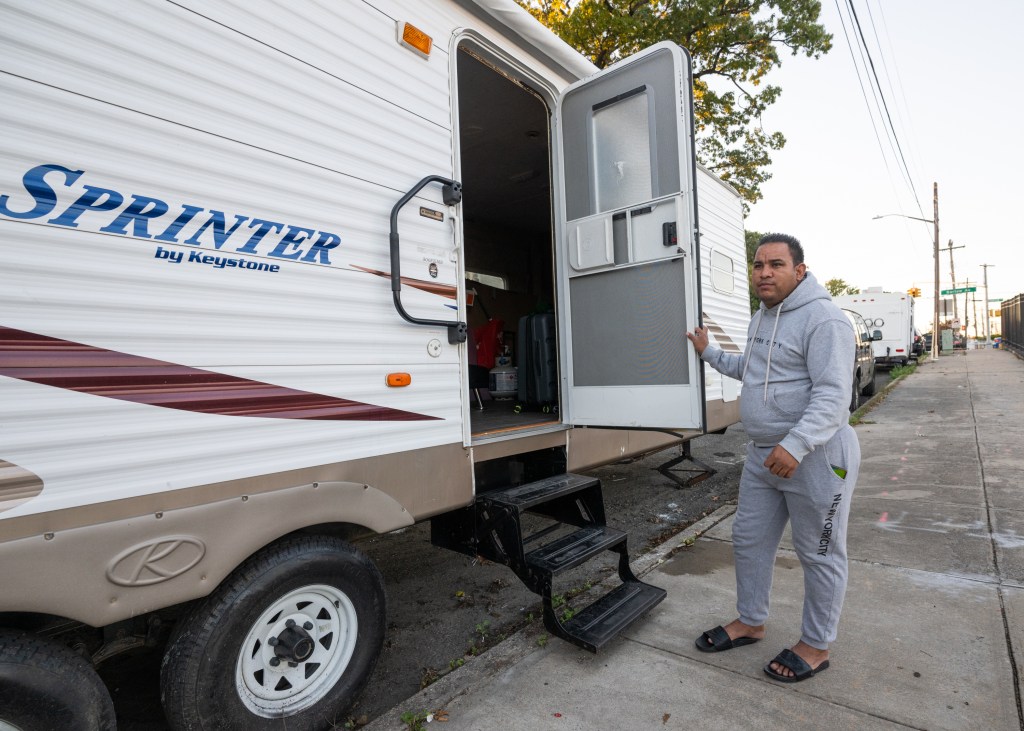 Gilberto Laguna outside of caravan he lives in on Bruner Avenue