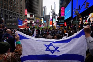 Supporters of Israel face people rallying in support of Palestinians in Times Square in New York on October 8, 2023.