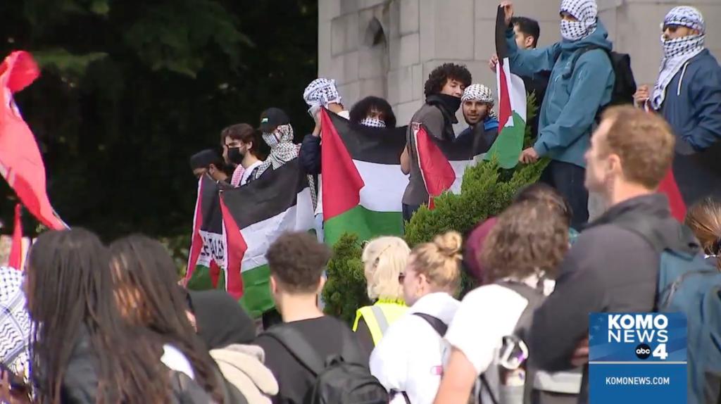 Students participating in the "Day of Resistance" are pictured holding Palestinian flags.