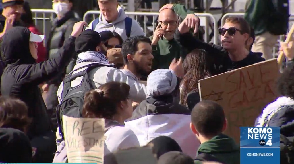 A screengrab of footage showing students confronting and yelling at one another.