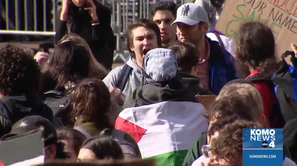 A Jewish student is pictured confronting one of the pro-Palestine activists.