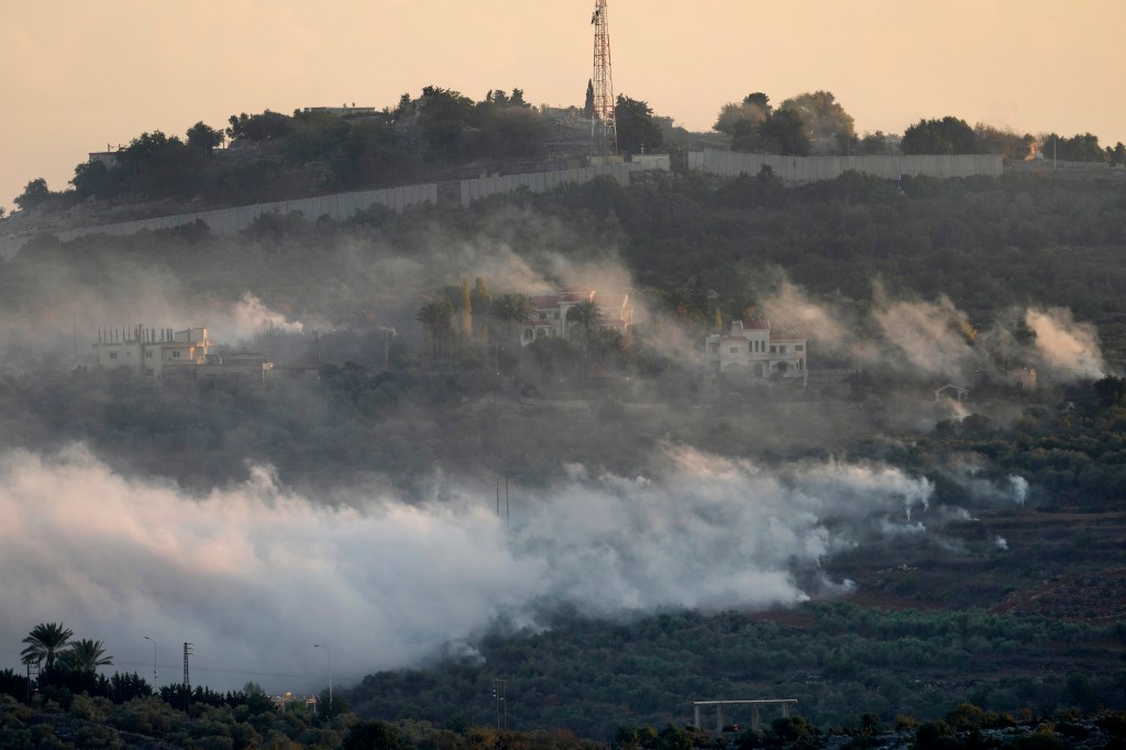 Smoke rises from Israeli artillery shelling in Dahaira, a Lebanese border village with Israel