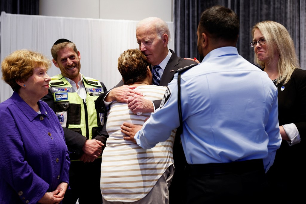 Biden embracing an Israeli woman during a meeting with first responders and people directly impacted by the attack from Hamas.