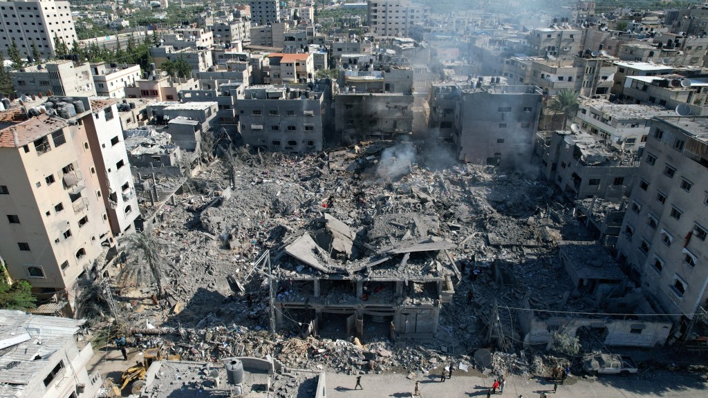 The site of an Israeli air strike on houses in the Gaza Strip on October 18, 2023.