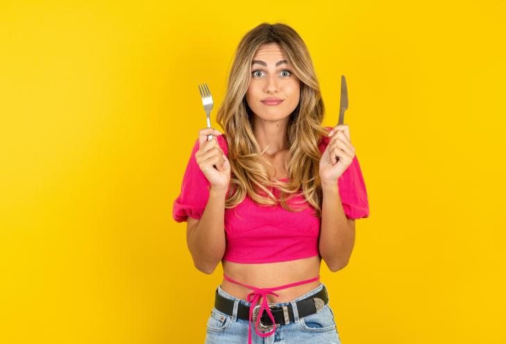 hungry MODEL holding in hand fork knife want tasty yummy pizza pie