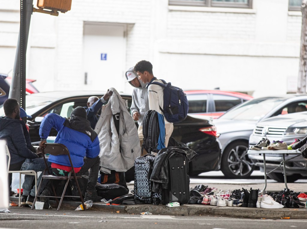 According to locals, migrants have set up a market selling things like food or shoes.