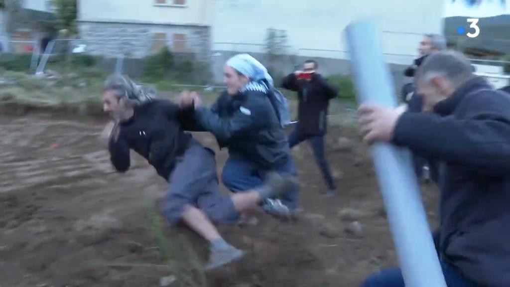 A French nun tackles an environmental protester attempting to stop construction of a religious center.