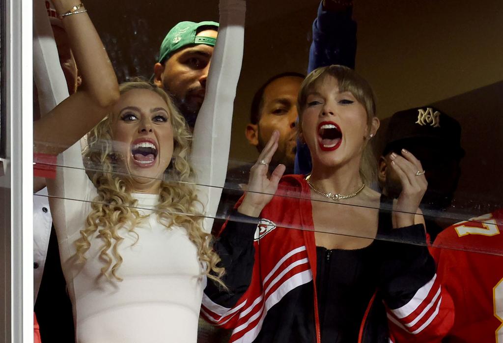 Taylor Swift (left) and Brittany Mahomes cheer during the Chiefs' win.