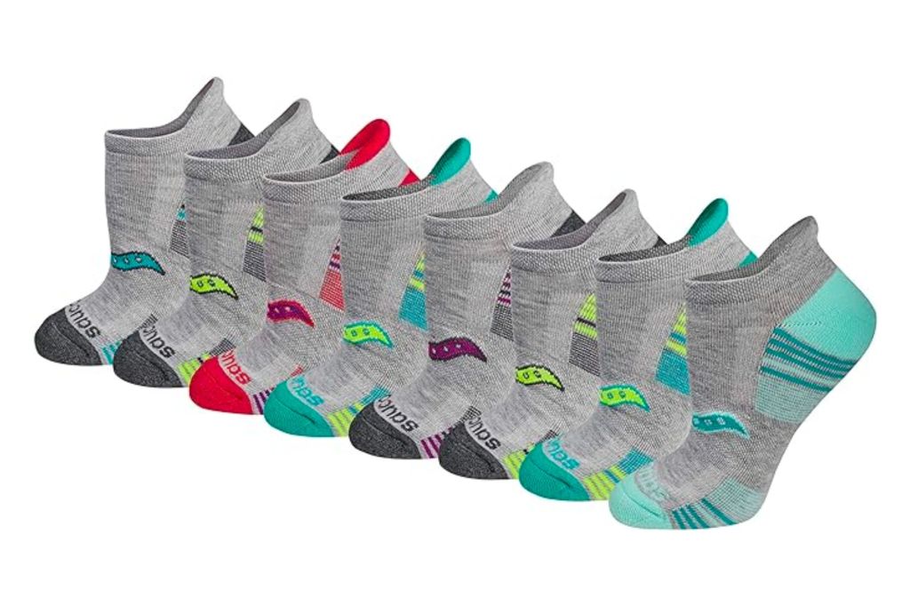 Eight pairs of different colored running socks in a row.