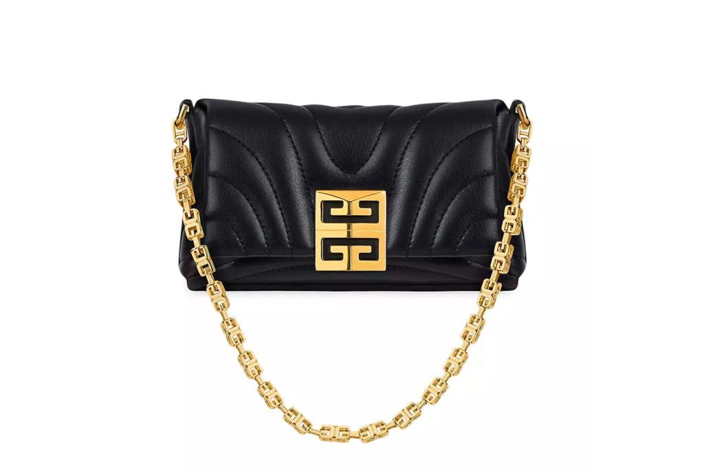 A black quilted leather purse with a gold logo clasp and gold strap.