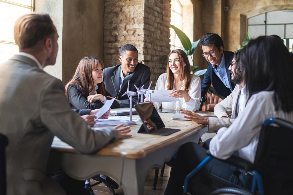 Group of multiethnic businesspeople discussing about financial strategy.