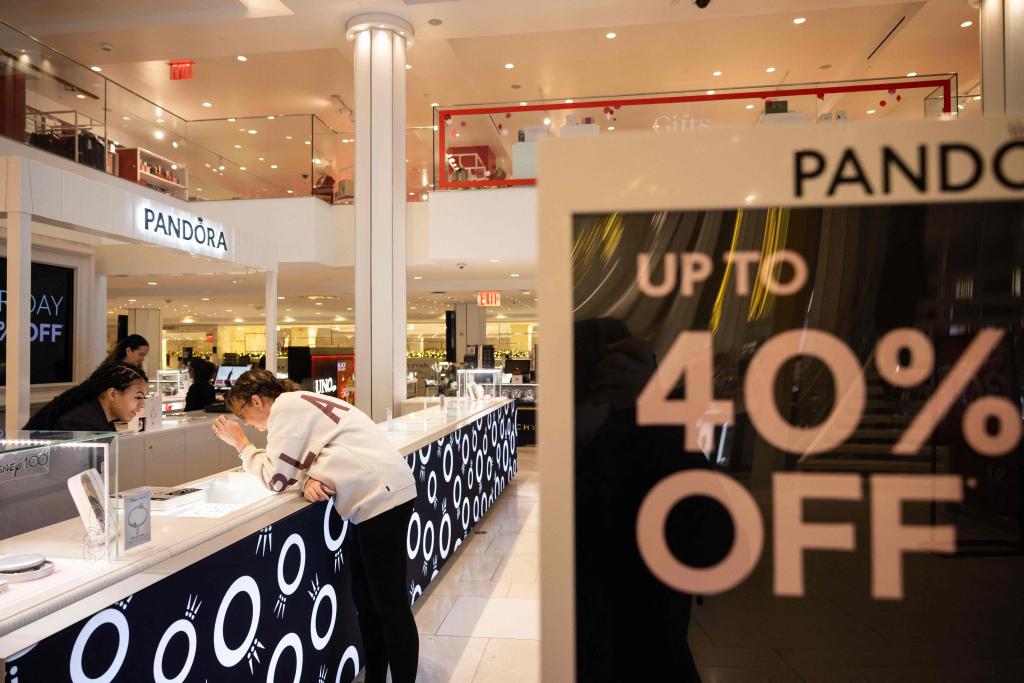 a 40% off sign in a Macy's store.