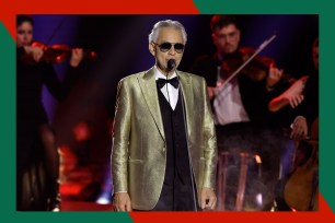 Andrea Bocelli performs onstage in a gold sport coat.