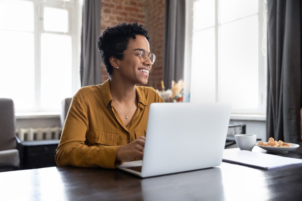 A woman researches how to budget simply.