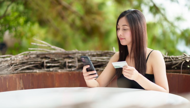 A woman researches credit cards.