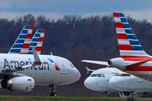 American Airlines planes sit stored at Pittsburgh International Airport on March 31, 2020, in Imperial, Pa.