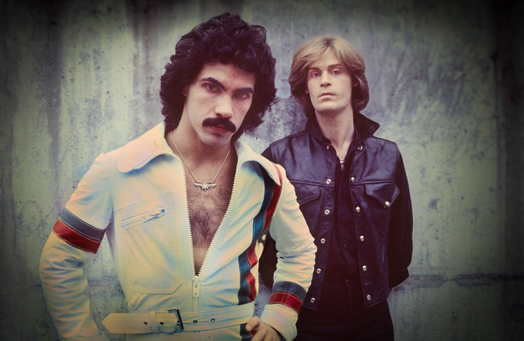 Daryl Hall and John Oates of Hall and Oates, posed outside of the TopPop Studio Hilversum, Netherlands, January 1976. They were recording a video for their hit single 'Sara Smile'. (Photo by Gijsbert Hanekroot/Redferns)