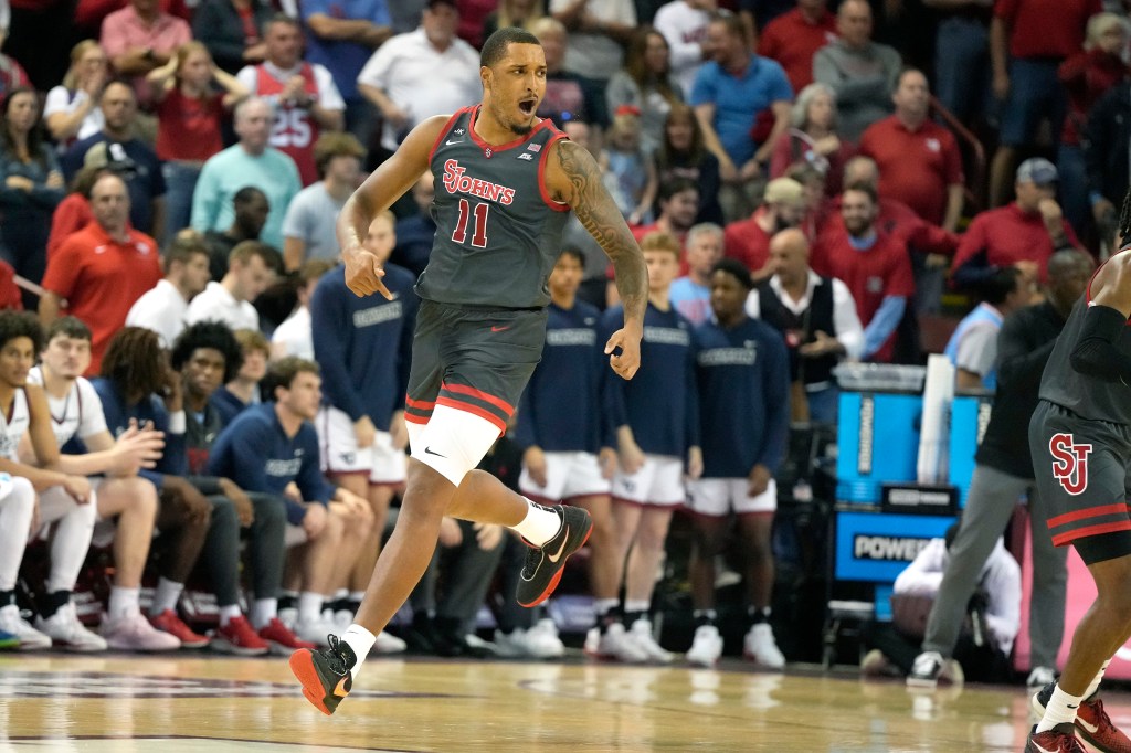 Joel Soriano #11 of the St. John's Red Storm celebrates a shot in the first half