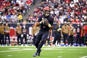 CJ Stroud holds the ball for the Houston Texans.