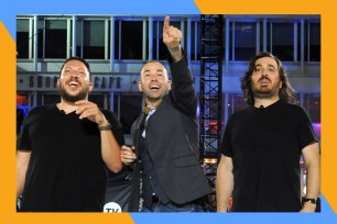 Sal (L), Murr and Q gawk at something above while onstage.