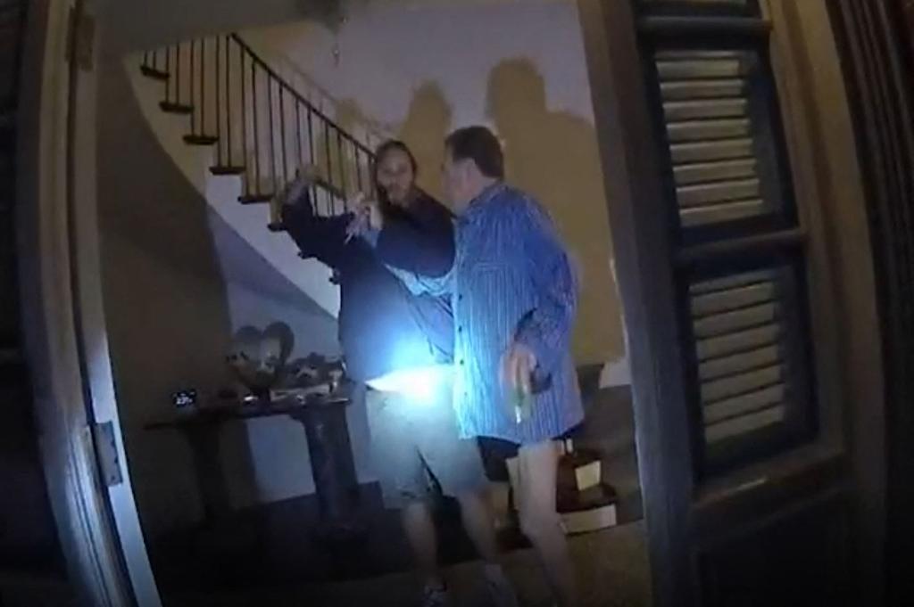 This still image from a San Francisco Police Department police body-cam video ordered released by San Francisco Superior Court, shows suspect David DePape (L) assaulting Paul Pelosi, husband of former Speaker of the House Nancy Pelosi, at their San Francisco home on October 28, 2022. - Dramatic video emerged on January 27, 2023 of the moment a man attacked the husband of former US House speaker Nancy Pelosi with a hammer in their San Francisco home last October, after Judge Stephen M. Murphy ordered the release of the evidence. (