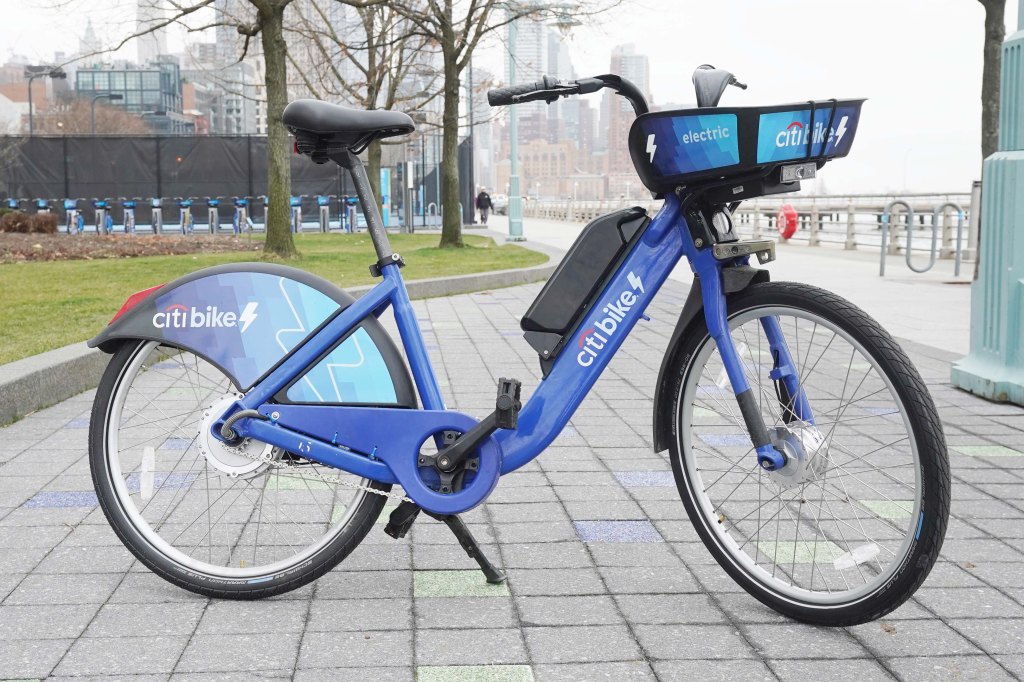 Citi e-bike parked on a sidewalk.