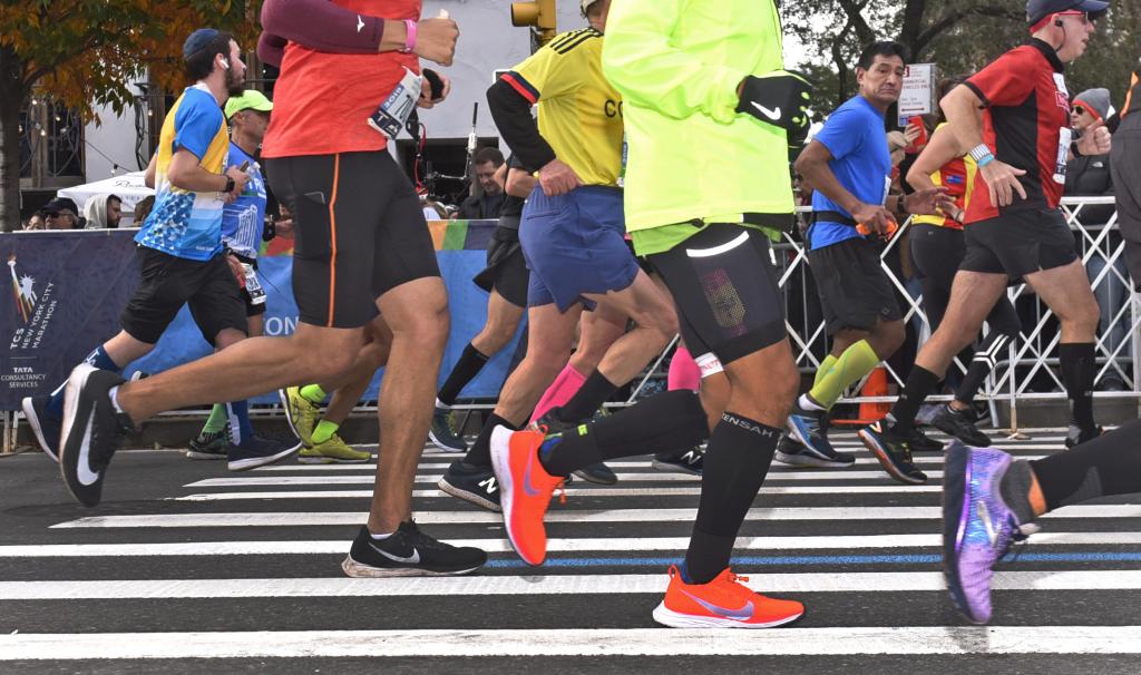 Runners make their way up First Avenue