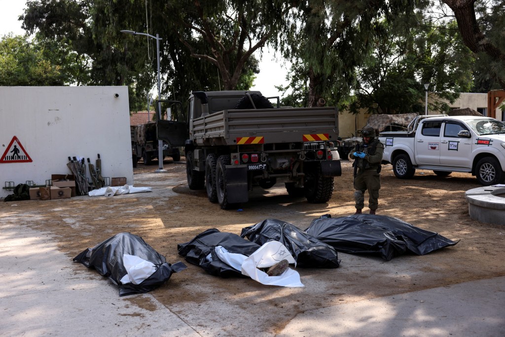 Body bags lined up the aftermath of Hamas' attack on a kibbutz near Gaza.