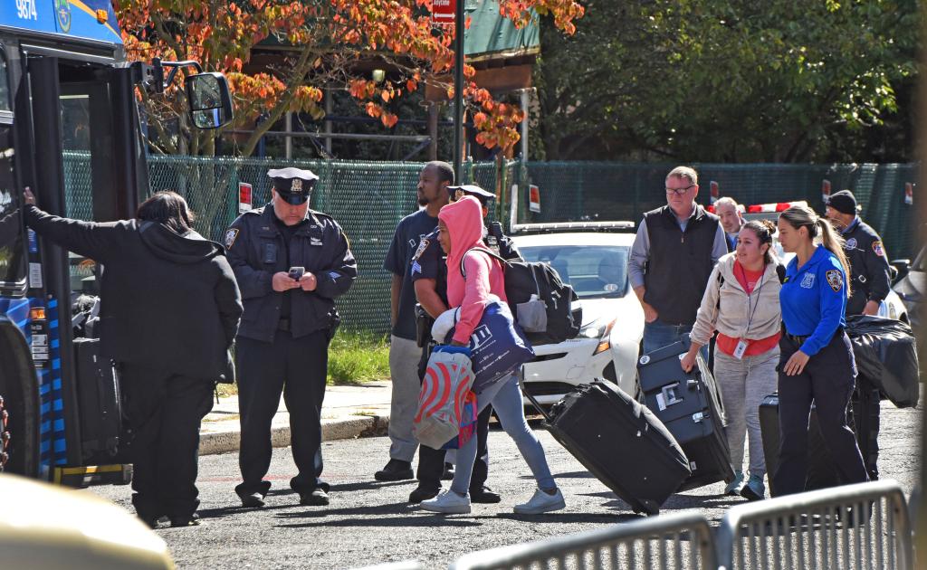 Migrants boarding bus