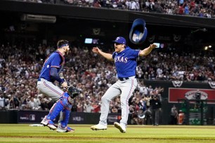 Texas Rangers catcher Jonah Heim, left, and relief pitcher Josh Sborz celebrate after Game 5 of the World Series.