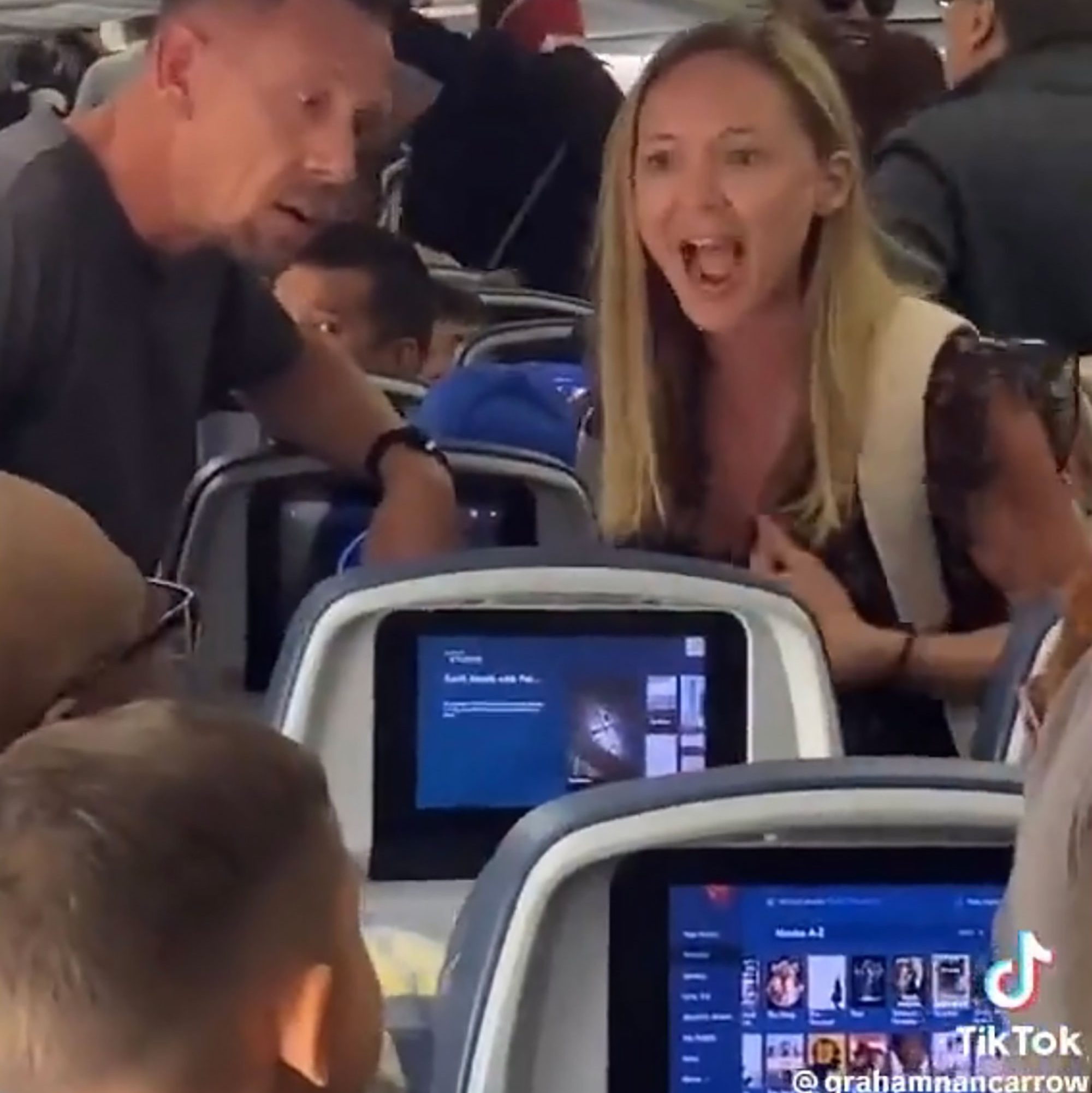 The woman was irate at the people behind her, who she said kicked her seat the whole flight