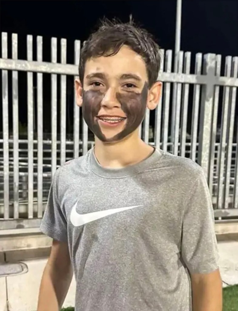 A middle school student identified only as J.A. is pictured in face paint.