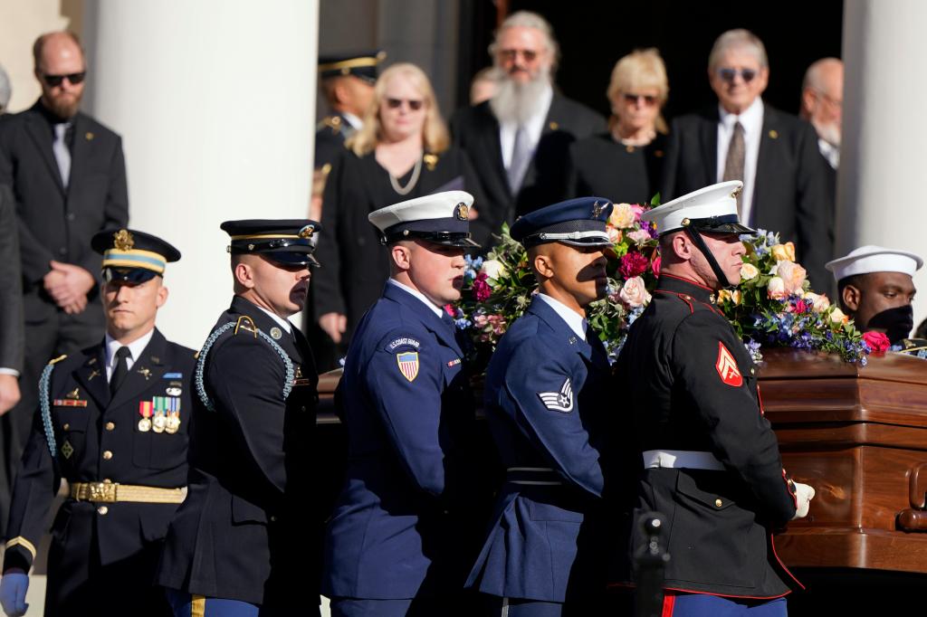 An Armed Forces body bearer team moves the casket of former first lady Rosalynn Carter after a tribute service at Glenn Memorial Church at Emory University on Tuesday, Nov. 28, 2023, in Atlanta.