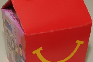 091111Fries1RK - EXCLUSIVE - a new kid's McDonald's Happy Meals wil be available starting tomorrow at select McDonald's restaurants, including this one on Avenue of the Americas between West 14 and West 15 Street, open 24 hours. The new meal has a smaller portion with fewer fries, a regular of chocolate milk, four chicken McNuggets and a bag of apple slices, and a boy's toy (red robot) or a girl's toy (Skechers sneaker and a star for a keychain, some tiny stickers are also included). For additional info, call PR contact Zoe at 201 280-9381. CREDIT: All Photographs Copyright © 2011 Robert Kalfus. All rights reserved. All photographs appearing in this email/ site are the property of Robert Kalfus and are protected by U.S. Copyright Laws and are not to be downloaded or reproduced in any way without the prior written permission of Robert Kalfus (917) 379-4165.