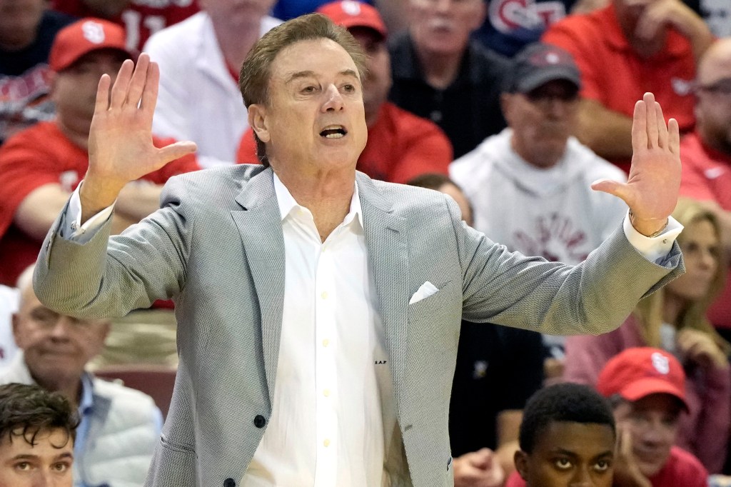 Rick Pitino of the St. John's Red Storm signals his players in the first half